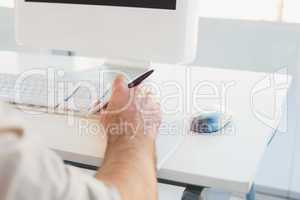 Businessman typing on computer keyboard