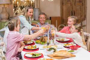 Three generation family enjoying christmas dinner together