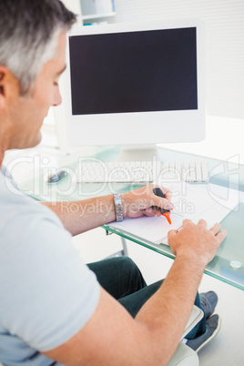 Man with highlighting information on a document