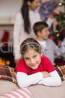 Cute little girl leaning on the couch