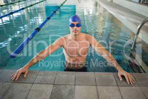 Fit swimmer in pool at leisure center