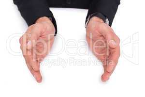 Close up of businessman with hands spread on the floor