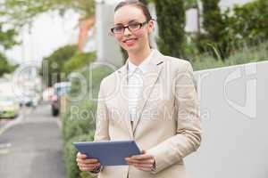 Young businesswoman using tablet pc