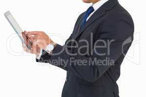 Businessman with watch using tablet pc