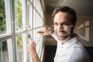 Construction worker fixing the window