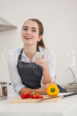 Pretty brunette cooking and watching tv