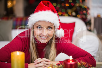 Portrait of a smiling blonde in hat at christmas