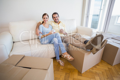 Young couple taking a break from unpacking