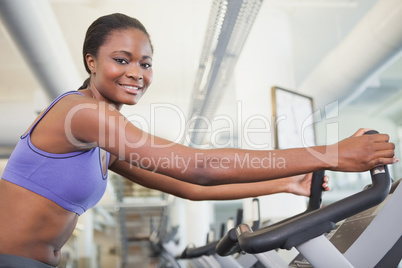 Fit woman working out on the exercise bike