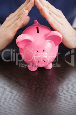 Young man with piggy bank