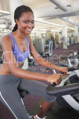 Fit woman working out on the exercise bike