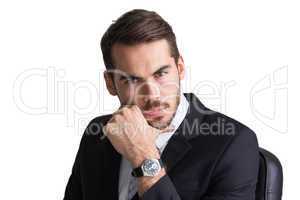 Cheerful businessman posing with hand on chin