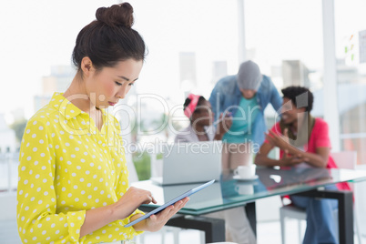 Young creative woman using her tablet