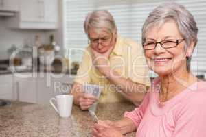 Senior couple playing cards at the counter