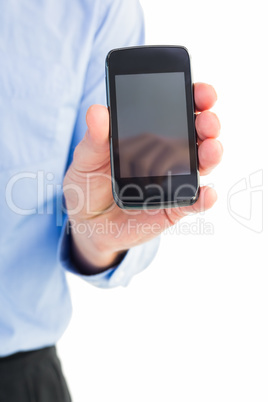 Businessman showing his smartphone to camera