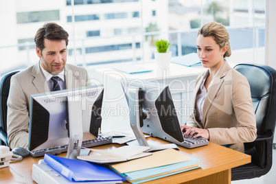 Focused business people using computer