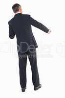 Businessman in suit standing and doing gesture