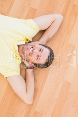 A man lying on floor at home