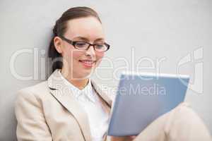 Young businesswoman using tablet pc