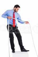 Focused businessman pulling a rope
