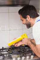 Plumber putting filling in between tiles