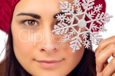 Close up of a brunette holding snowflake