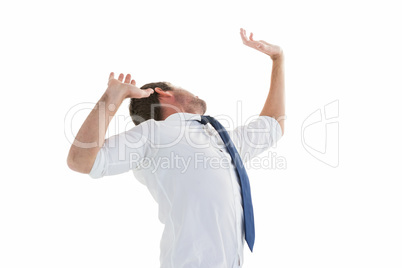 Businessman in suit with hands raised Businessman in suit with hands raised