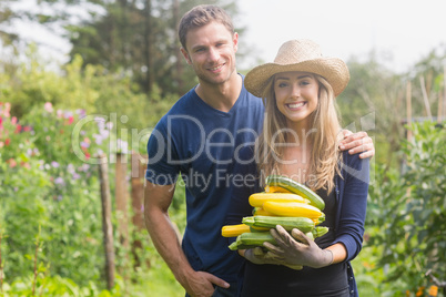 Cute couple gardening on sunny day