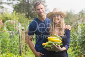 Cute couple gardening on sunny day