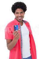 Happy man holding credit card
