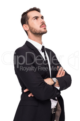 Thinking businessman with his arms crossed