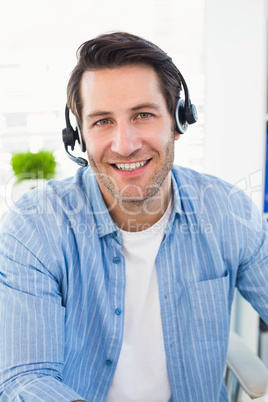 Smiling photo editors wearing a headphone