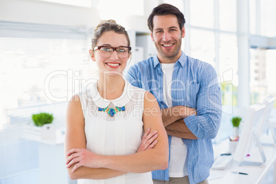 Smilling photo editor posing with arms crossed