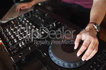 Close up of hands spinning the decks