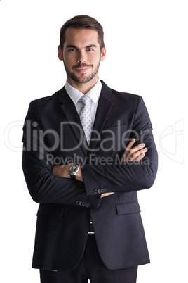 Smiling businessman posing with arms crossed