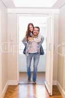Cute couple walking through the door
