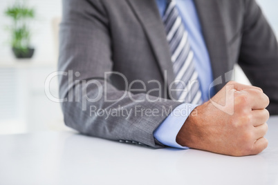 Angry businessman banging his fist