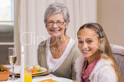 Portrait of grandmother and daughter at christmas