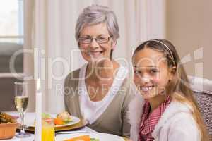 Portrait of grandmother and daughter at christmas
