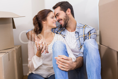 Cute couple sitting on floor