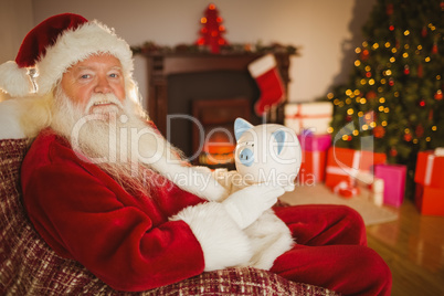 Santa claus holding piggy bank