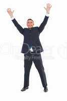 Happy businessman in suit with arms up