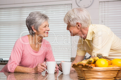 Senior couple having coffee together