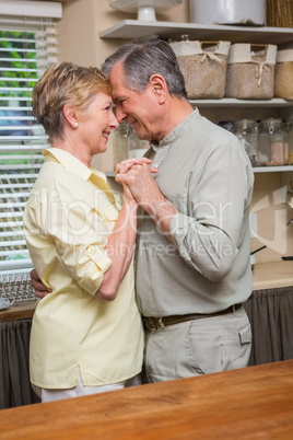 Romantic senior couple dancing together