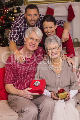 Happy family posing with presents