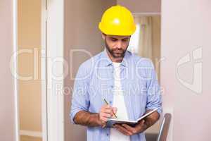 Casual architect reading his notes