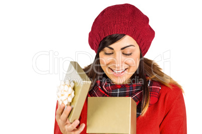 Happy brunette opening christmas gift