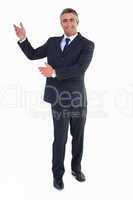 Smiling businessman in suit doing gesture