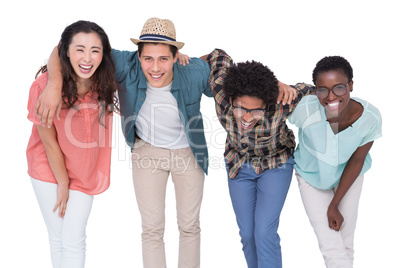 Stylish friends smiling at camera together