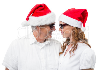 Festive couple smiling at each other Festive couple smiling at each other